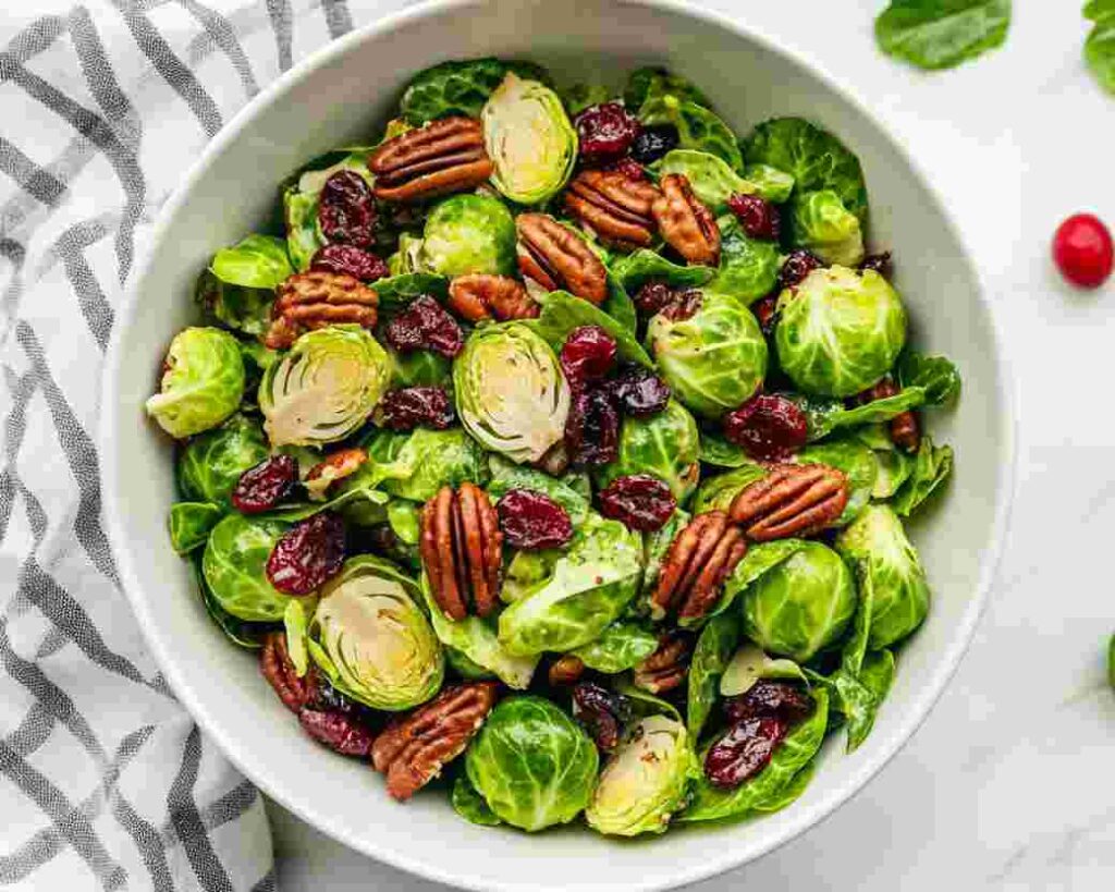 Shaved Brussels Sprout Salad with Pecans and Cranberries